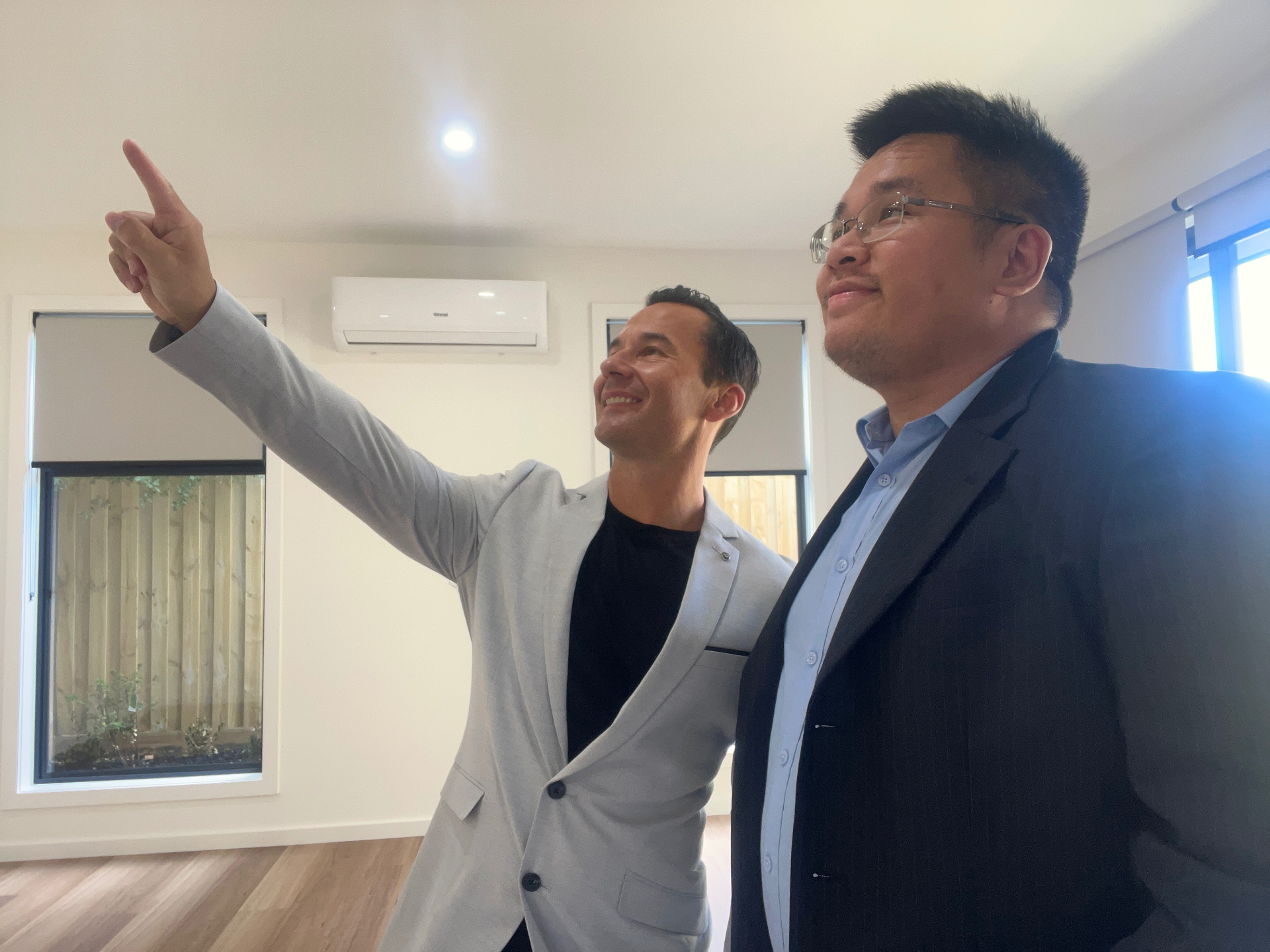 Crest Property team inspecting a Melbourne investment property with a client